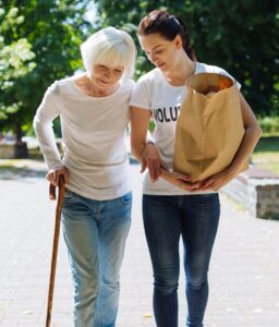 Volunteer helping seniors